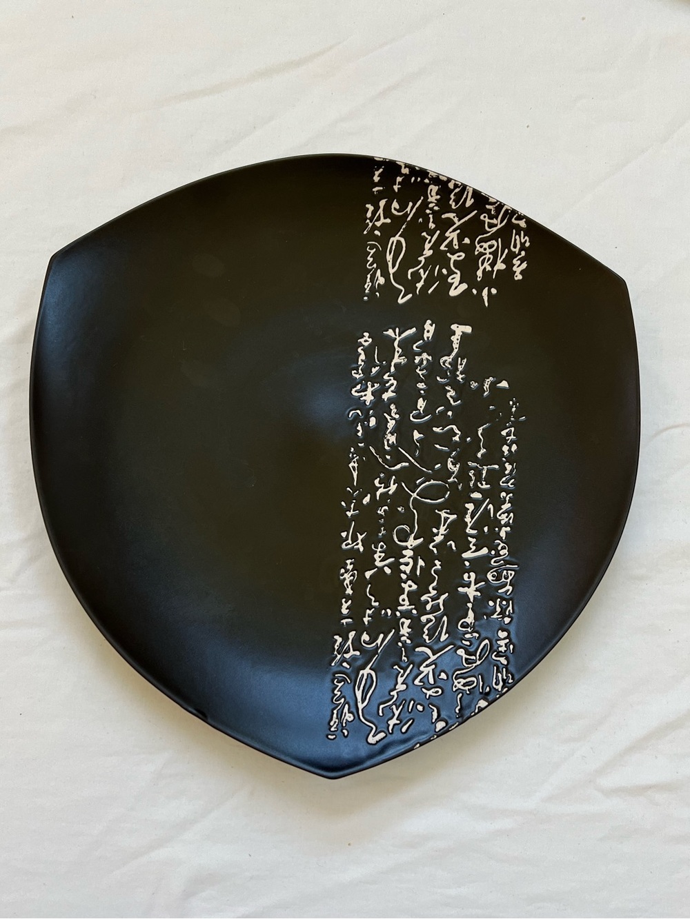 Japanese Black Porcelain Plate With Cream Colored Inscription 12" Shield Shape